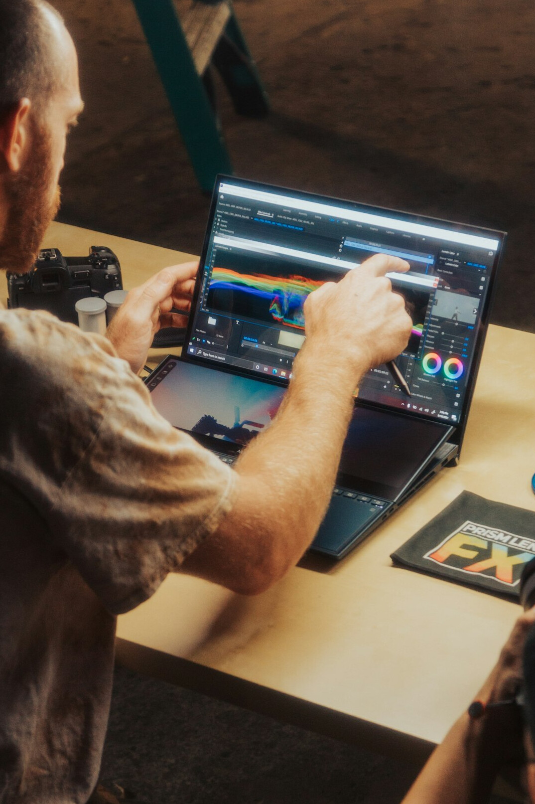 graphic designer using software on laptop